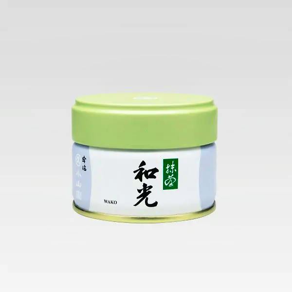 A single canister of Wako matcha green tea with a light green lid and a white label bearing Japanese characters.