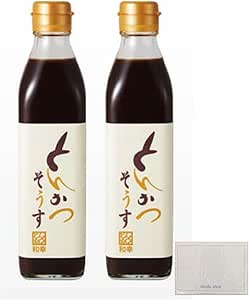 Two bottles of pork cutlet sauce with white labels and gold caps shown side by side.