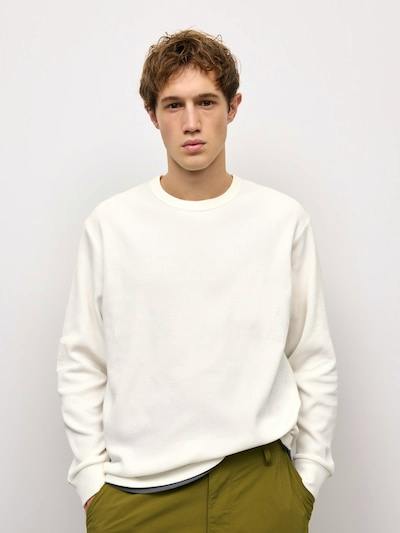 Male model wearing the Warm Waffle long-sleeve crew neck T-shirt in white, shown from the front.