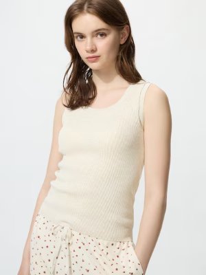 A model wearing an off-white ribbed sleeveless washable knit bra-top (tank top).