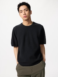 Male model wearing a black Milano rib knit T-shirt.
