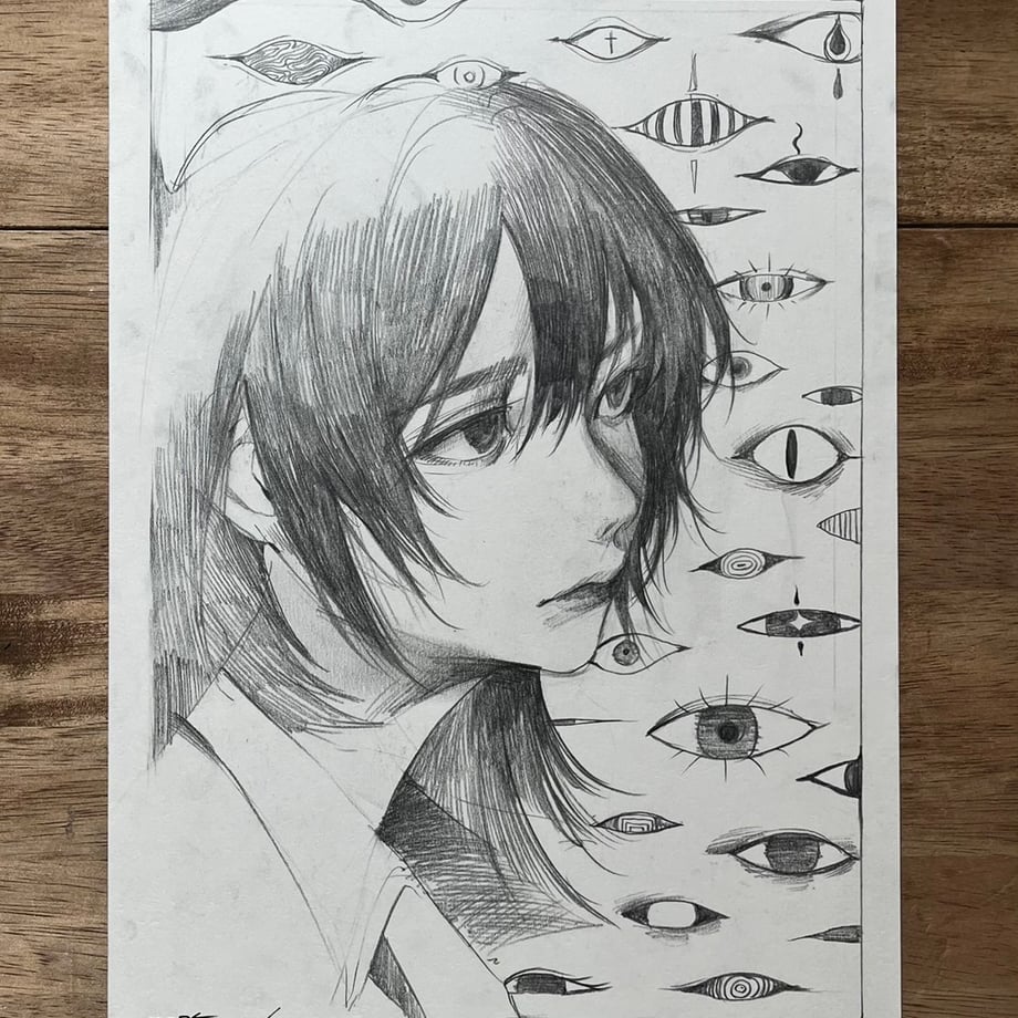 Photo of the hand-drawn pencil illustration depicting a person's head in profile surrounded by many stylized eyes.
