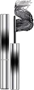 Silver curling mascara tube with wand and black mascara brush strokes visible.