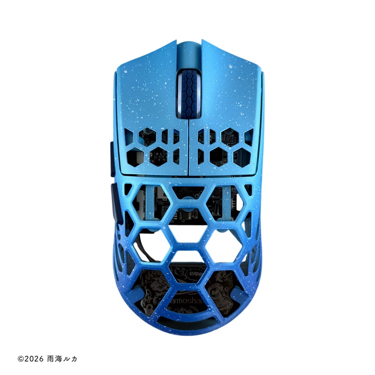 Top view of a blue honeycomb-shell gaming mouse with a speckled finish on a white background.