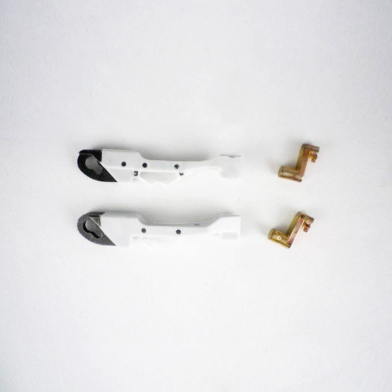 Two white elbow levers and two brass slider pieces for a Hollandia 400 DeLuxe sunroof.