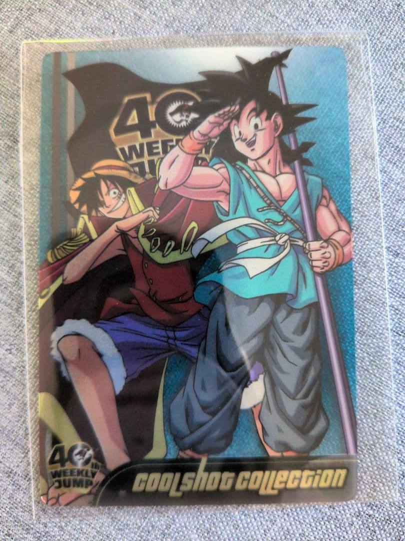 Front of the Weekly Shonen Jump 40th anniversary Dragon Ball & One Piece photocard showing printed artwork of Goku and Luffy inside a clear protective sleeve.