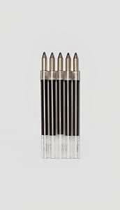 Five oil-based ballpoint pen refills in a clear plastic holder against a light background.