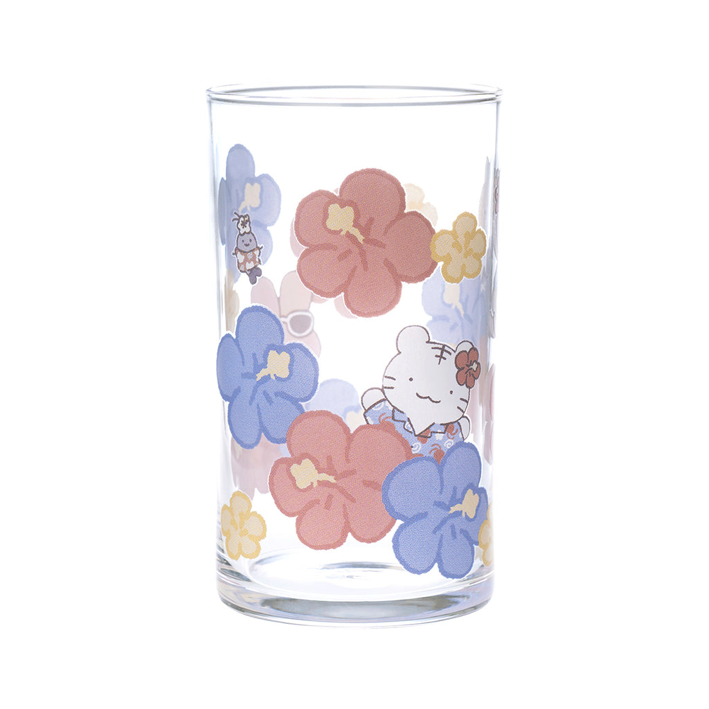 A clear straight drinking glass printed with pink and blue hibiscus flowers and a small white tiger character.