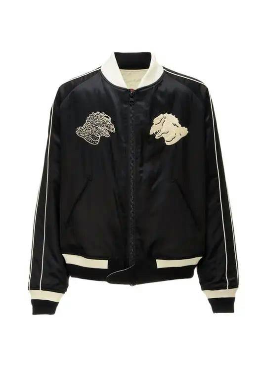 Front view of a black WWILDSIDE Yohji Yamamoto x IZUMONSTER reversible souvenir men's jacket with cream collar, cuffs, and embroidered monster motifs on the chest.