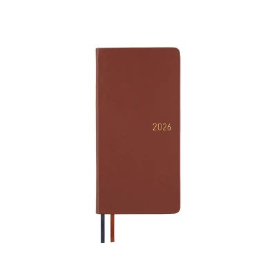 Front view of the wine brown leather weekly hardcover notebook embossed with "2026" and two ribbon markers.