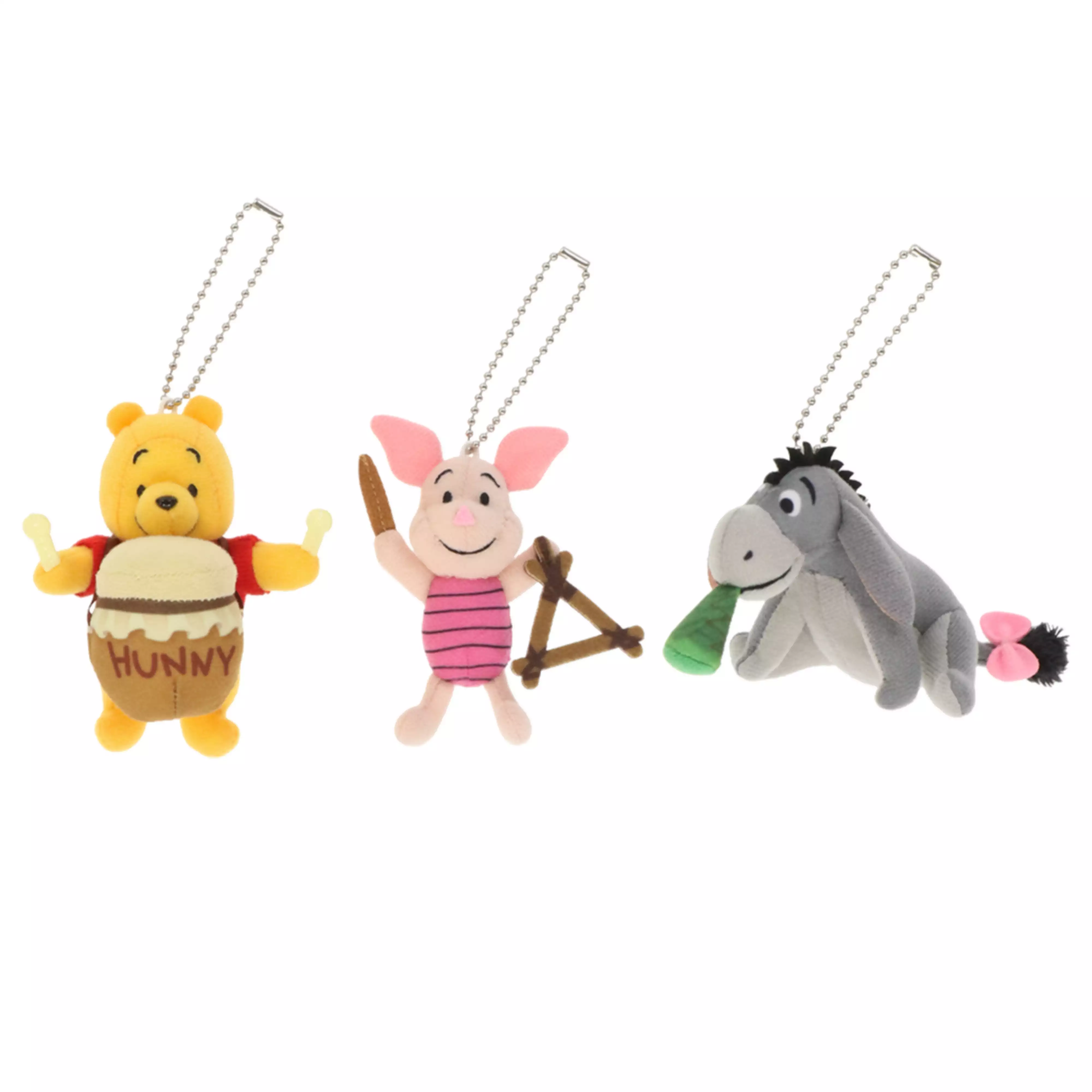 Three plush keychain charms of Winnie the Pooh characters (Pooh with a "HUNNY" pot, Piglet with a slingshot, and Eeyore), each with a ball chain.