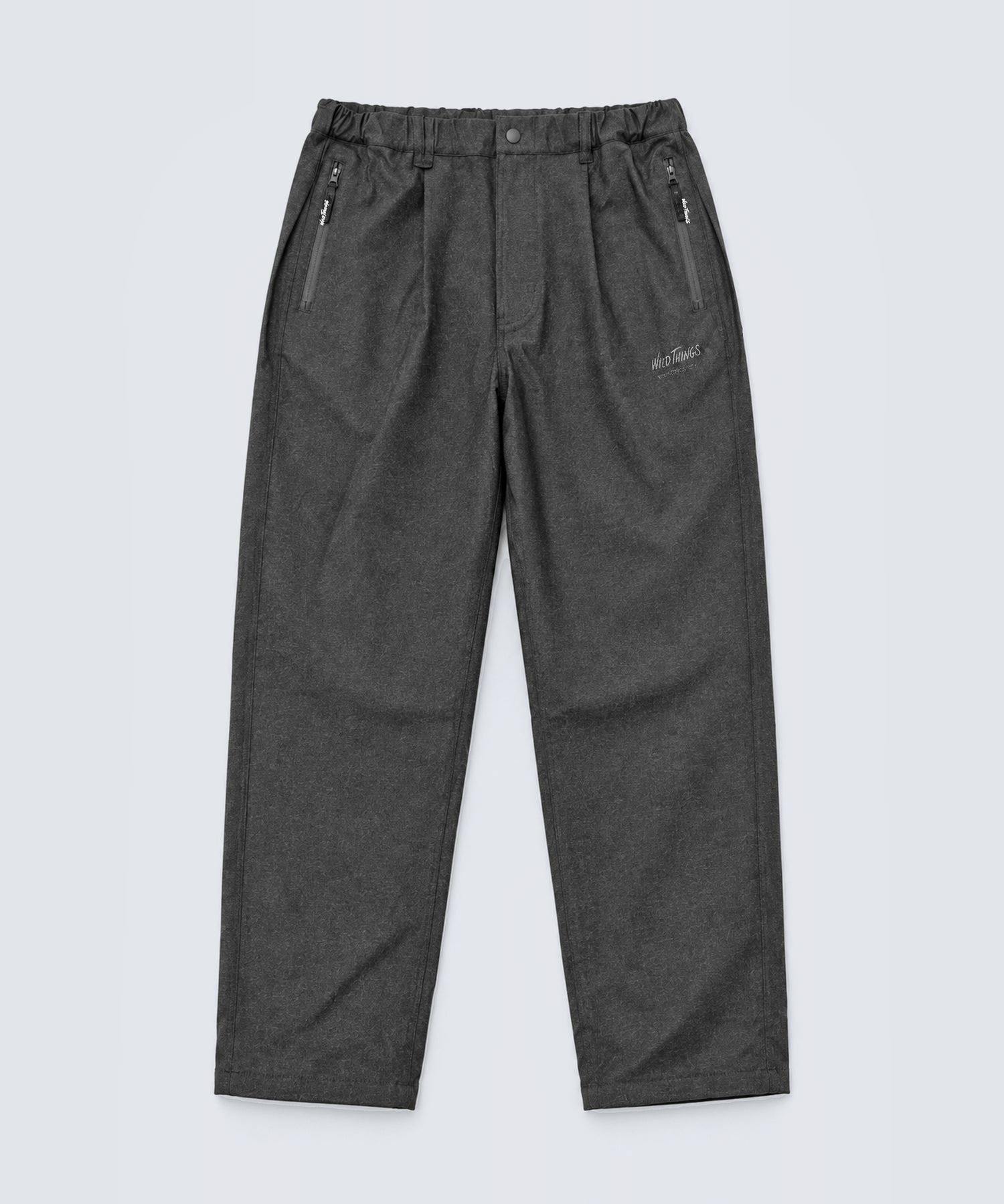 Front flat-lay of men's rayon pants showing elastic waistband, zip pockets, and tapered legs.