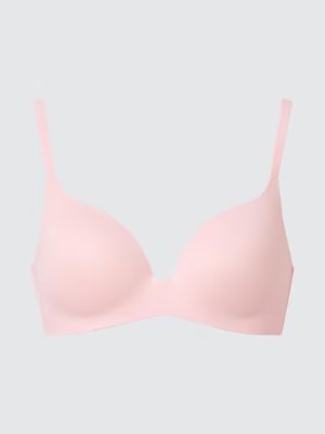 Front view of a light pink wireless bra on a neutral background.