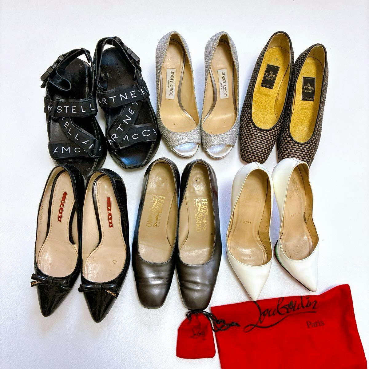 Top-down photo of six pairs of women's leather shoes arranged on a white background, with visible brand labels including Prada, Fendi, and Jimmy Choo.