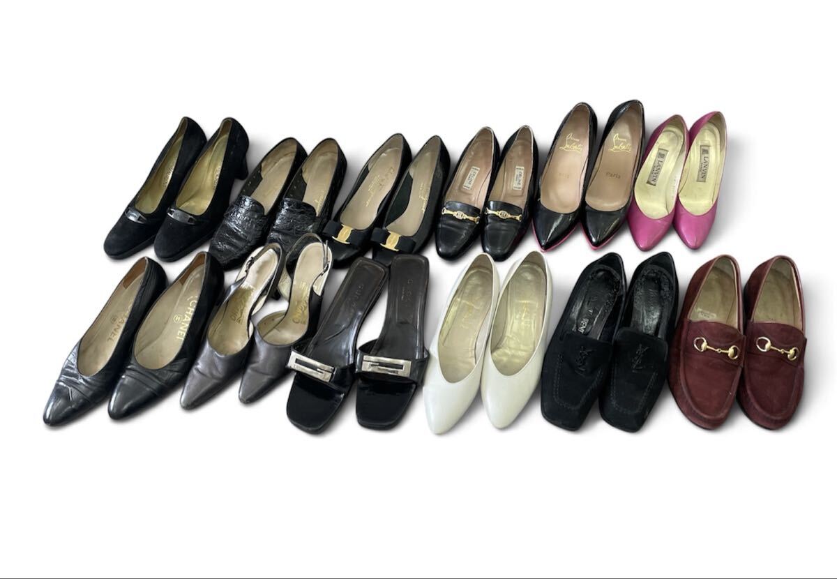 Twelve pairs of women's leather shoes (pumps, loafers, and sandals) arranged in two rows on a white background.