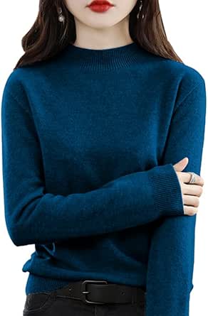 Front view of a model wearing a teal women's high-neck, long-sleeve knit sweater cropped at the hips.