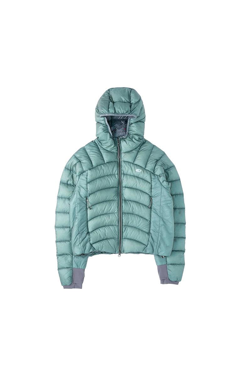 Front view of the women’s hooded lightweight down jacket laid flat, showing the quilted nylon exterior and center zipper.