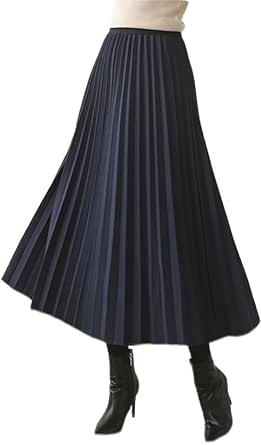 Long pleated women's skirt displayed on a model wearing black ankle boots.