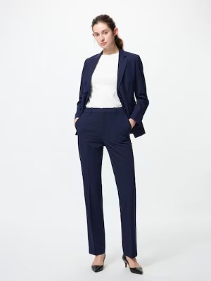 Model wearing the stretch straight women's pants shown full-length.