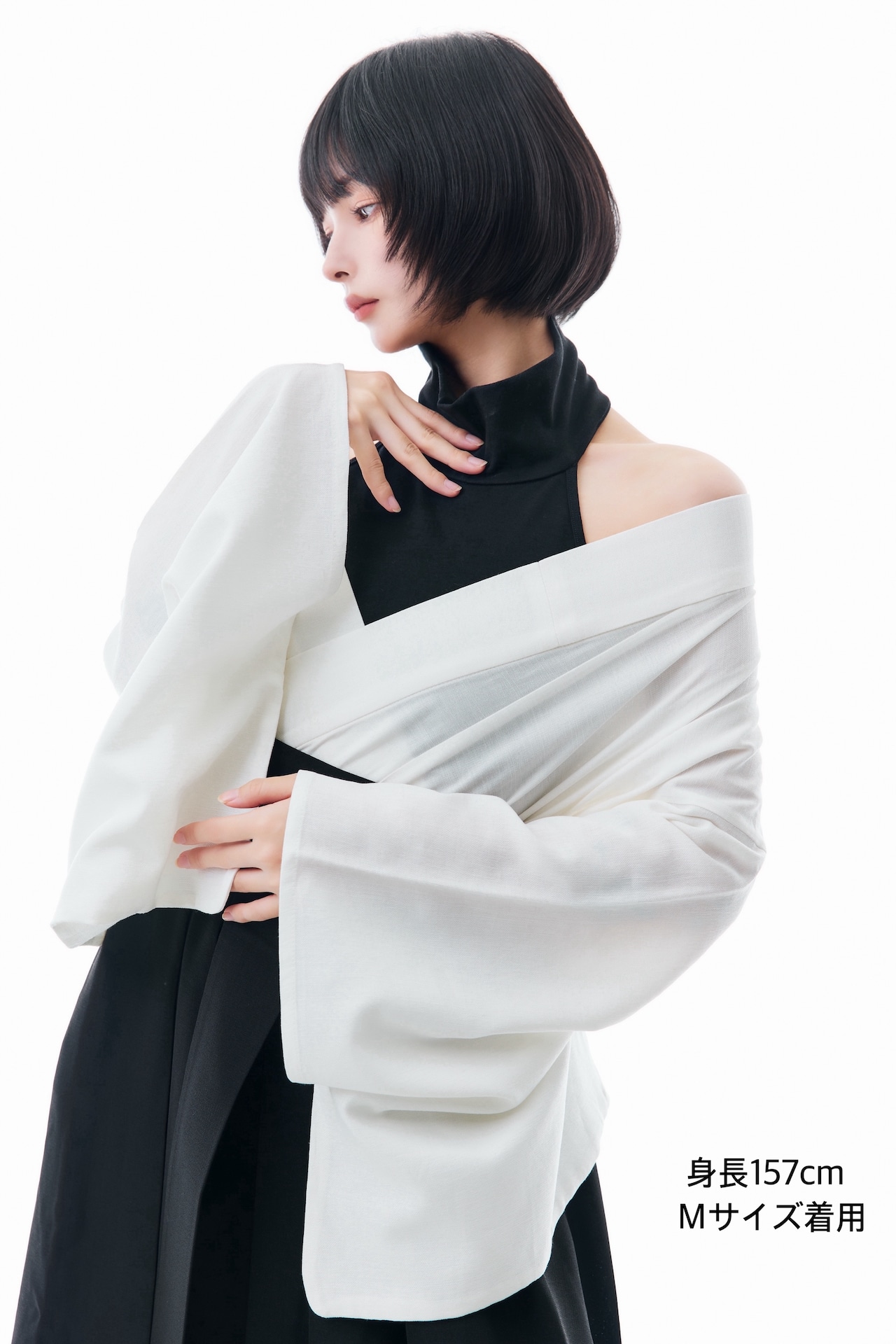 A model wearing the white summer half-kimono women's blouse shown in a three-quarter pose.