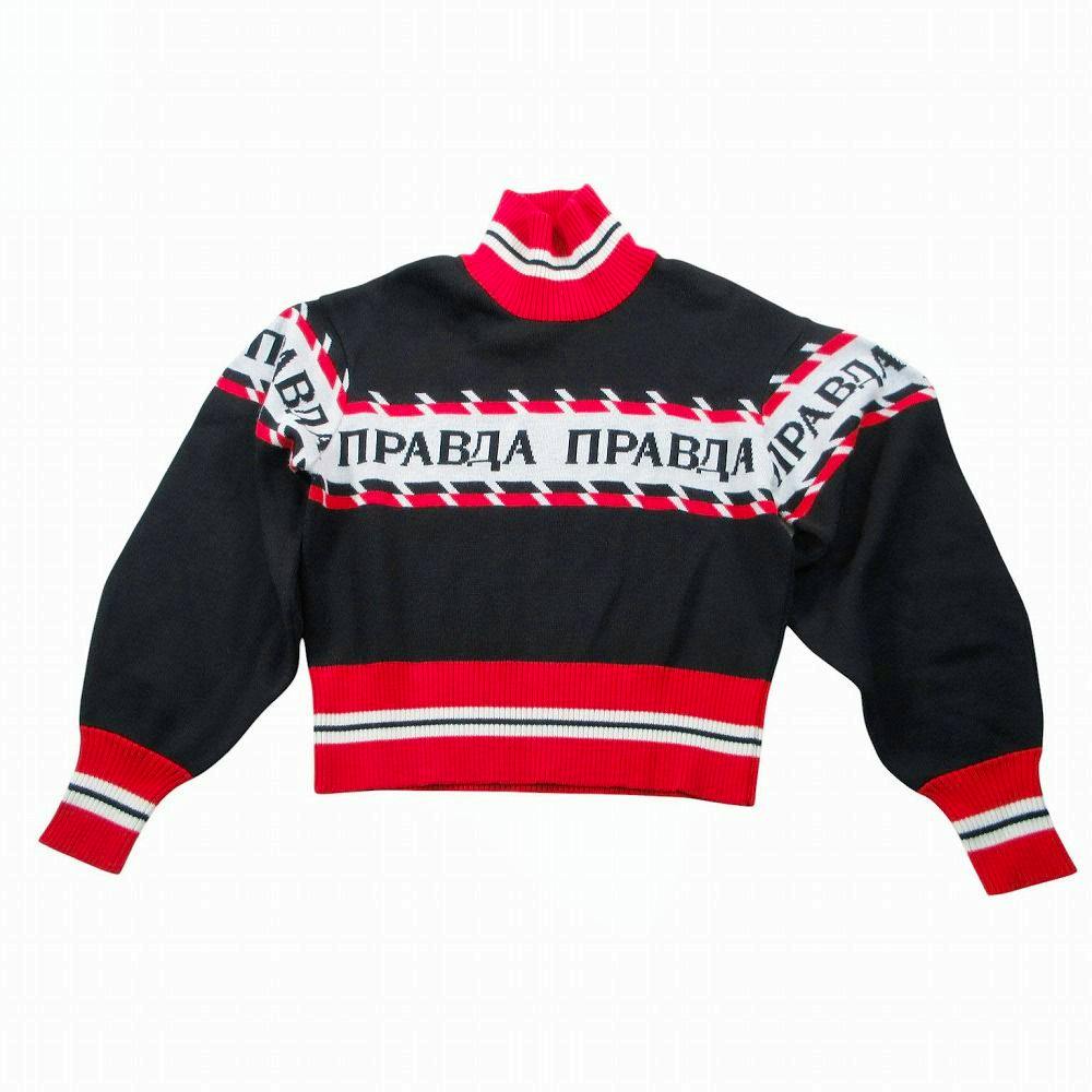 Flat-lay women's sweater in black and red with a white patterned band and Cyrillic lettering across the chest.