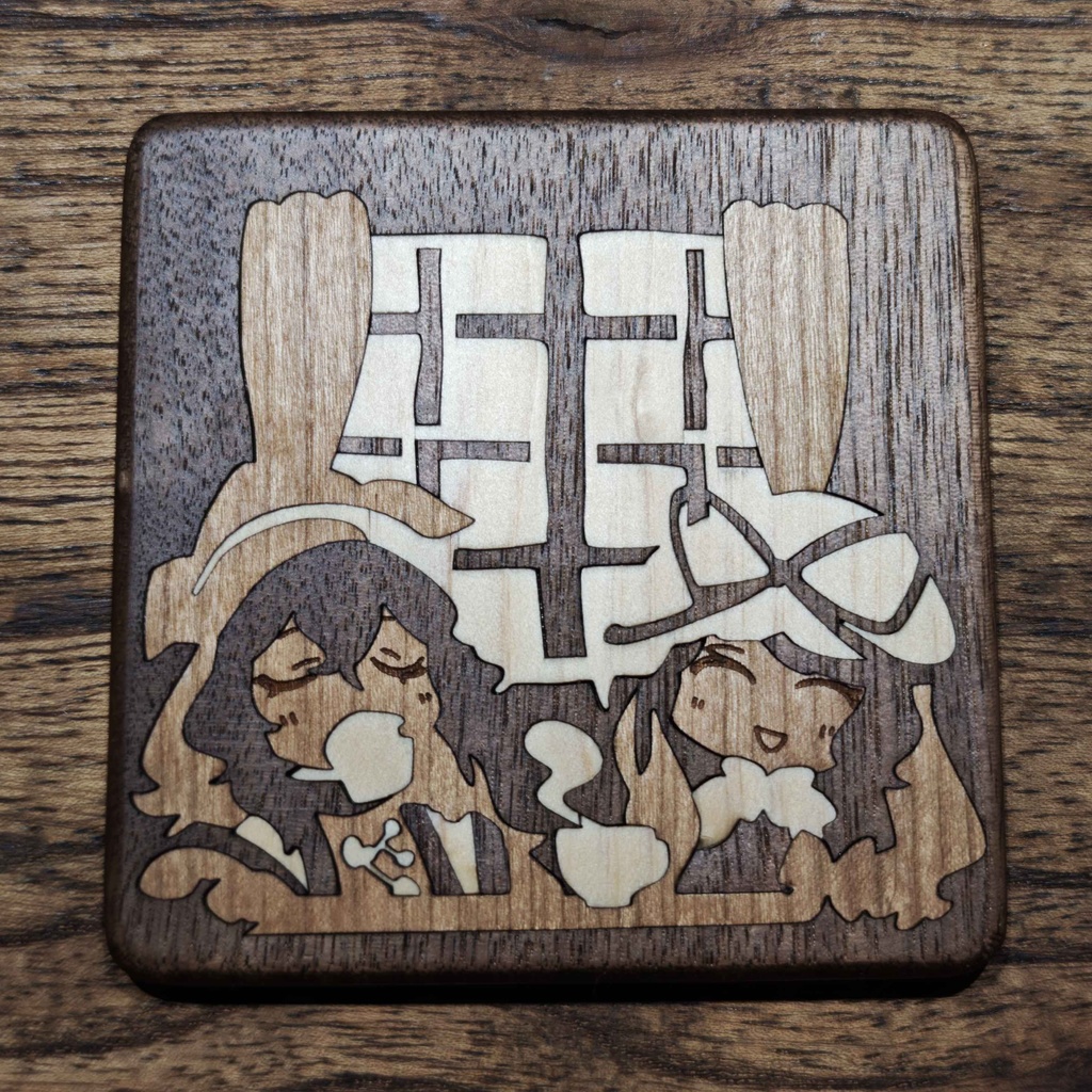 Square wooden coaster with inlaid artwork showing two stylized characters and a window motif.