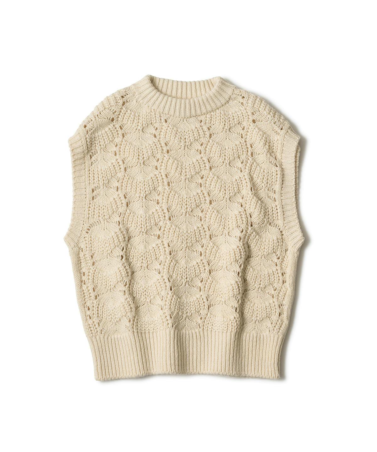 Cream-colored lacy knit vest laid flat on a white background.
