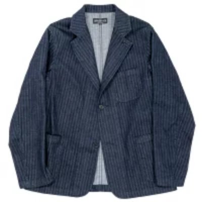 Front view of the WORKERS indigo herringbone lounge jacket laid flat, showing the jacket's exterior.