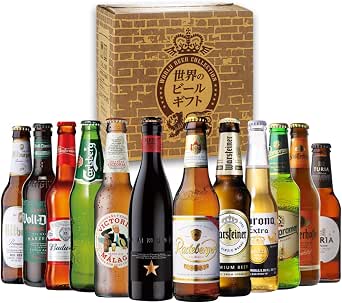 Twelve assorted bottled beers arranged in a row in front of a decorative gift box.