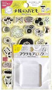 Packaged clear stamp sheet showing small Scandinavian-style icons with a plastic acrylic block visible in front.