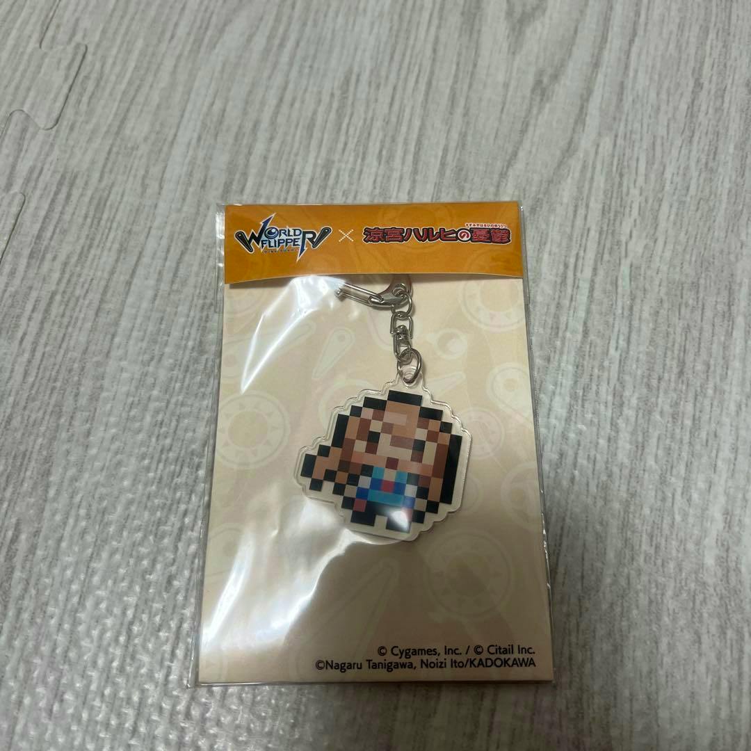 Packaged acrylic keychain of Asahina Mikuru (World Flipper × The Melancholy of Haruhi Suzumiya) visible in its plastic bag with header card.