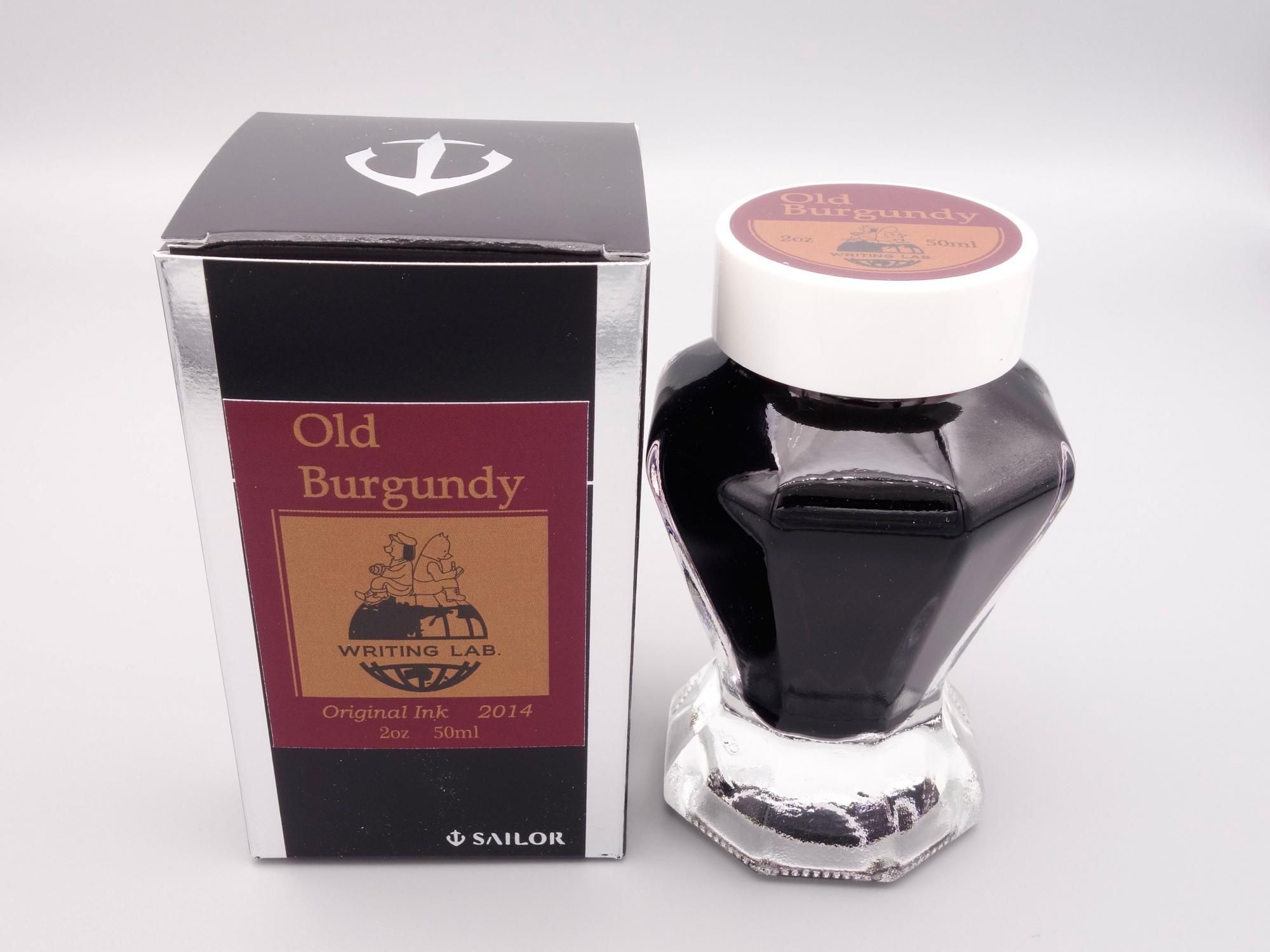 Photo of a bottle of WRITING LAB. Old Burgundy fountain pen ink displayed next to its box.