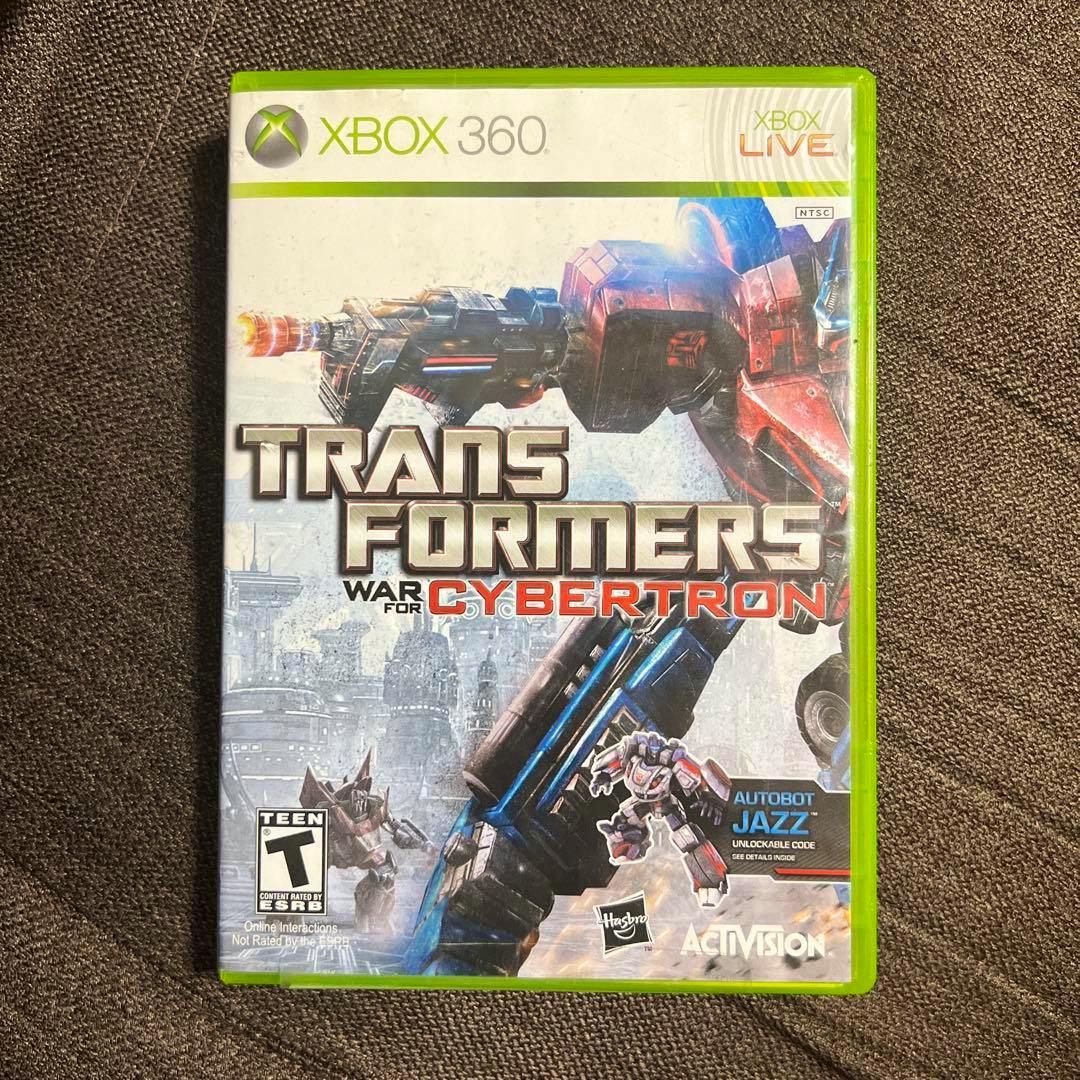 Front cover of the Xbox 360 game case for "Transformers: War for Cybertron" showing the game's title and cover art.