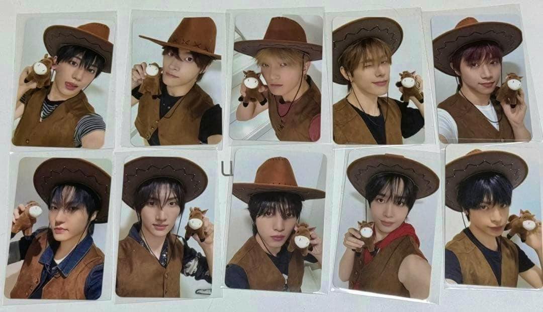 Ten Xikers photocards arranged in two rows, each showing a member wearing a cowboy hat and holding a small plush toy.