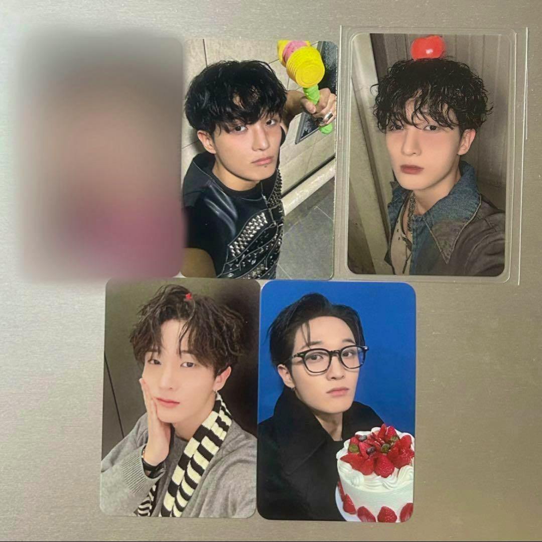 Five Xikers photocards showing portrait photos displayed on a flat surface.