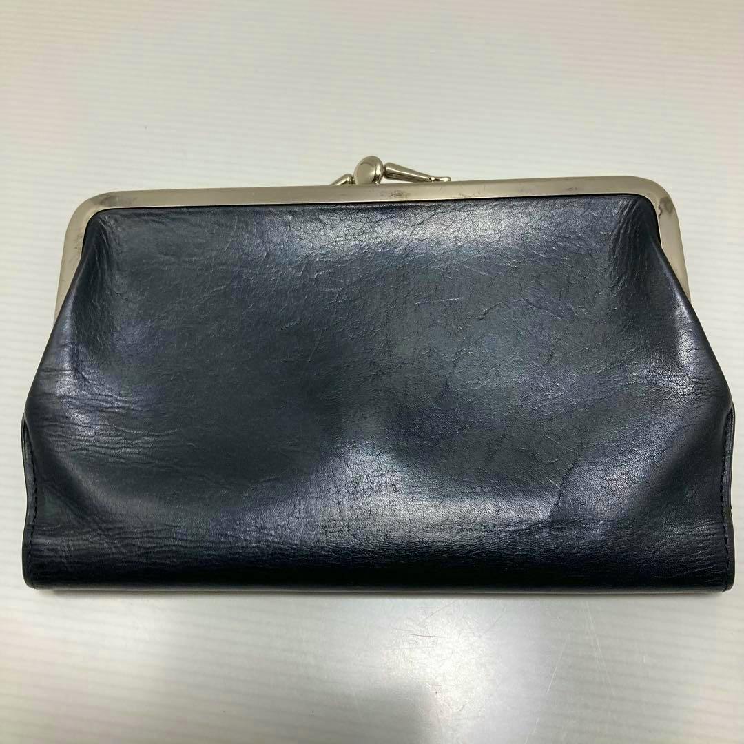 Black long leather wallet with a metal frame clasp shown flat on a white surface.