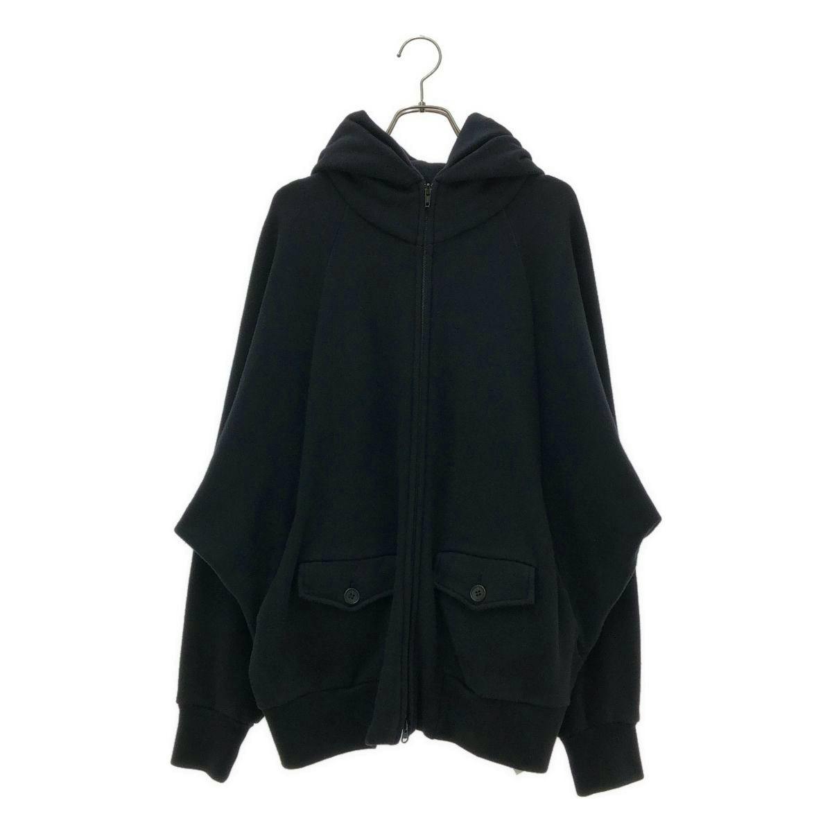 Front view of a black women's hooded zip-up sweatshirt (Y's / Yohji Yamamoto) hanging on a hanger.