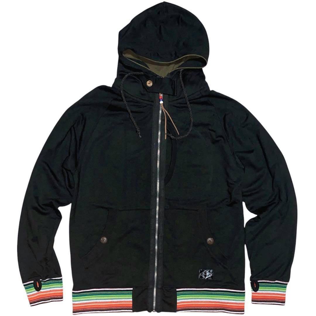 Front view of a black zip-up hooded cotton sweater with multi-colored striped cuffs and hem and finger-opening (thumbhole) details.