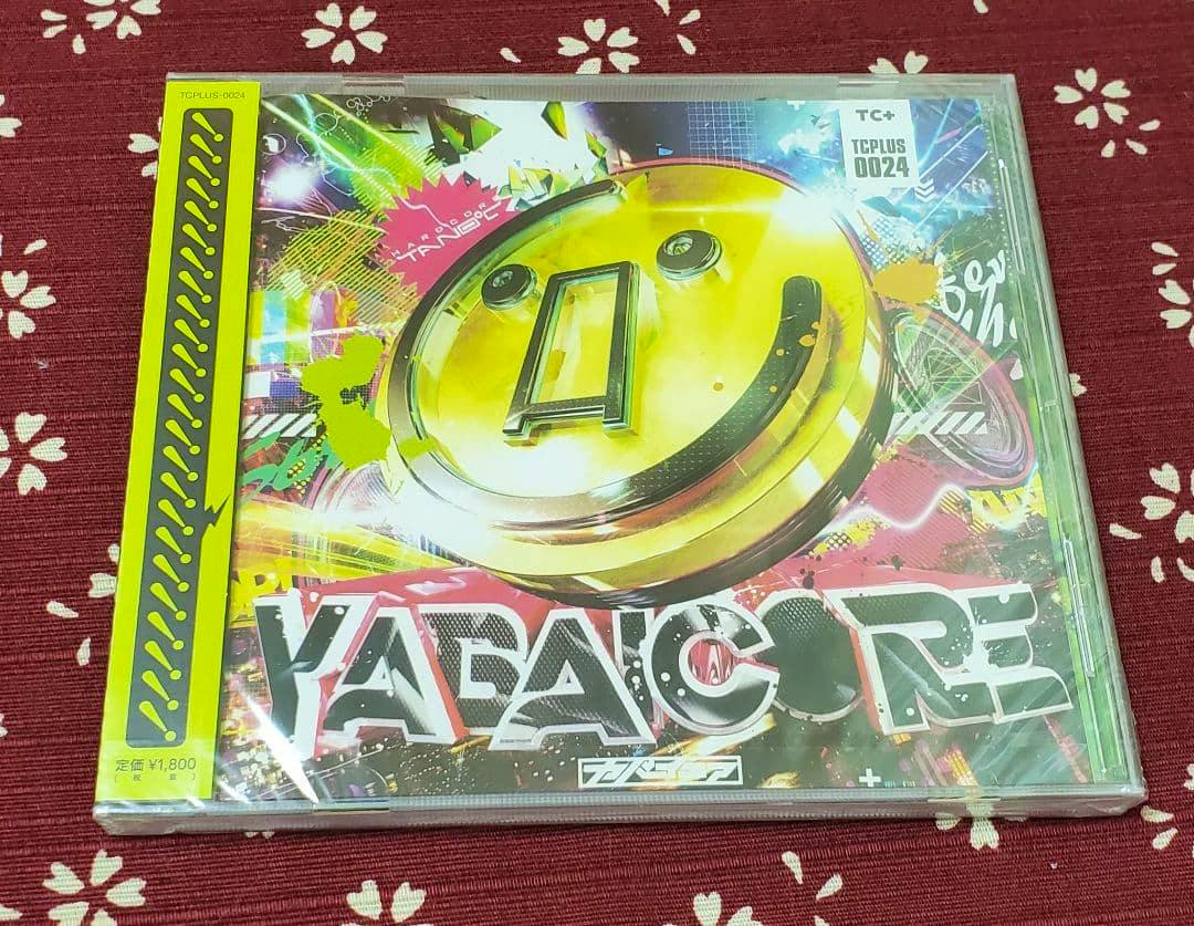Front view of a sealed YABAICORE CD jewel case showing the colorful cover art and title.