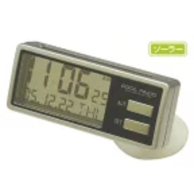 Rectangular solar-powered digital car clock on a round stand showing time and date on an LCD display.