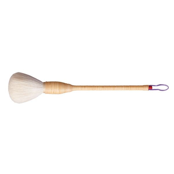 A long-handled makeup brush with white bristles, a wrapped wooden handle, and a purple hanging loop at the end.