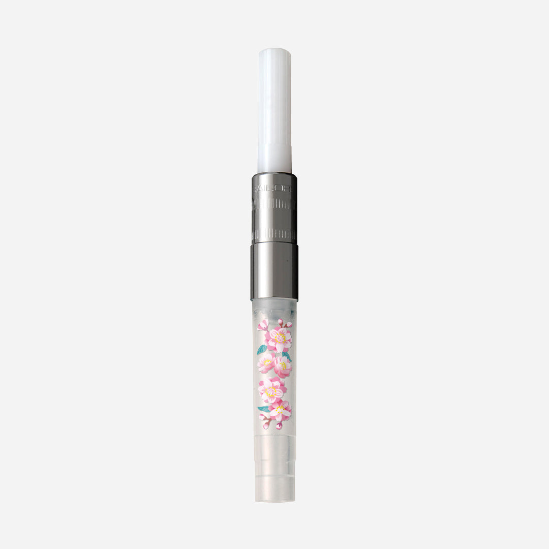 Ink converter for a fountain pen showing a clear body with pink cherry blossom (八重桜) decoration.