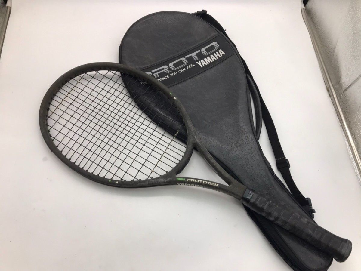 YAMAHA PROTO-02SX tennis racket shown with its carrying case on a white background.