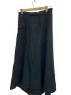 Long wool women's skirt hanging on a hanger against a white background.
