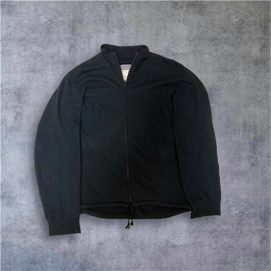 Front view of a black men's zip-up jacket laid flat showing collar, zipper, and drawstring hem.