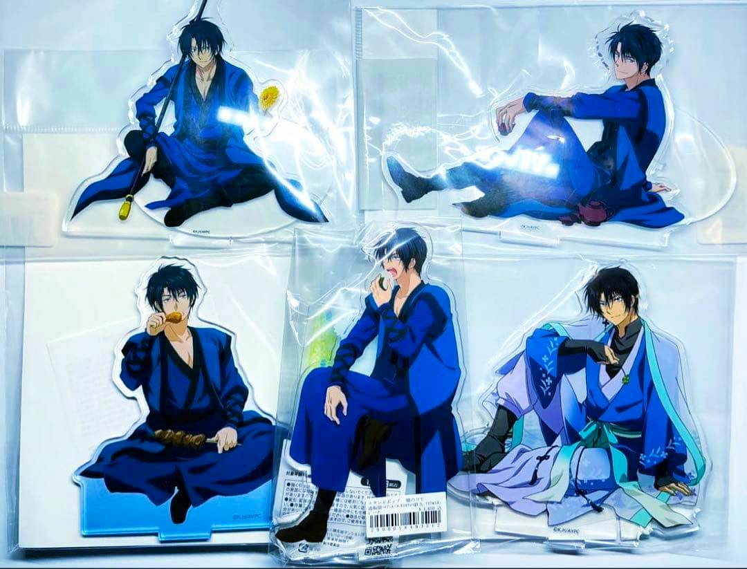 Photo of multiple packaged acrylic stands showing Haku from Akatsuki no Yona in various blue outfits arranged on a white background.