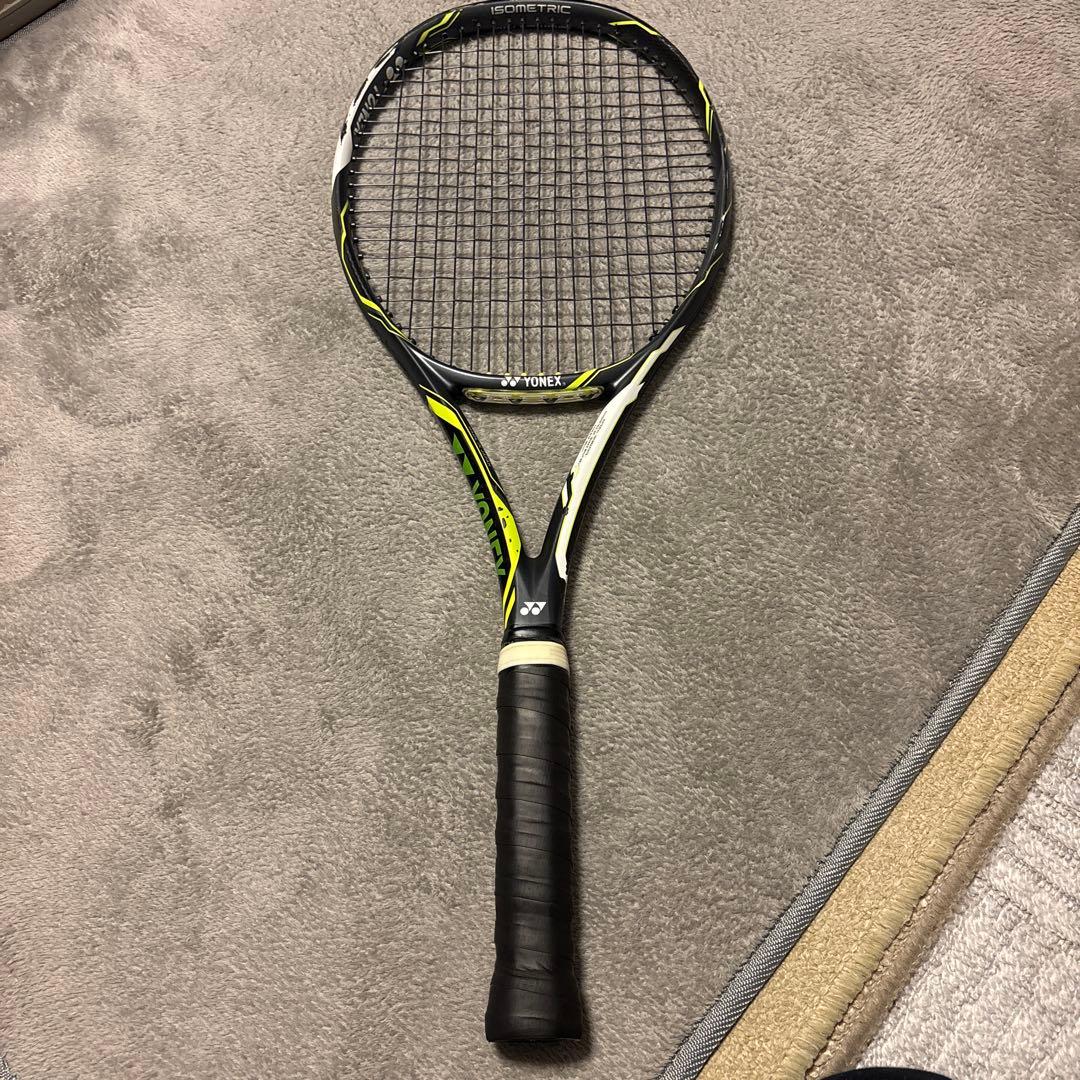 Full YONEX E ZONE DR 98 tennis racket lying on a carpet, showing the grip and strung head.