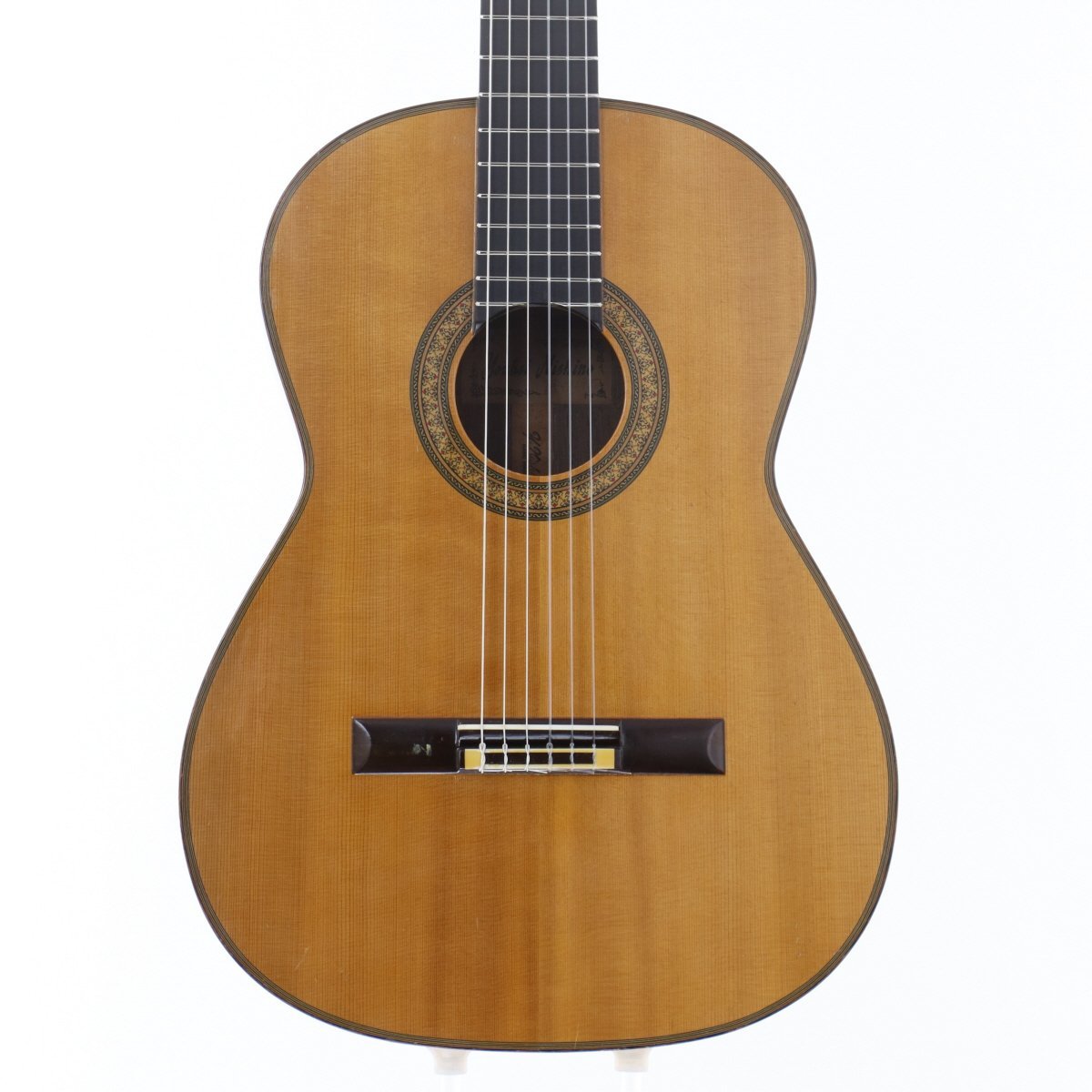 Front view of the Youhei Nishino No.30 acoustic guitar showing the soundboard, rosette, bridge, strings, and lower fretboard.