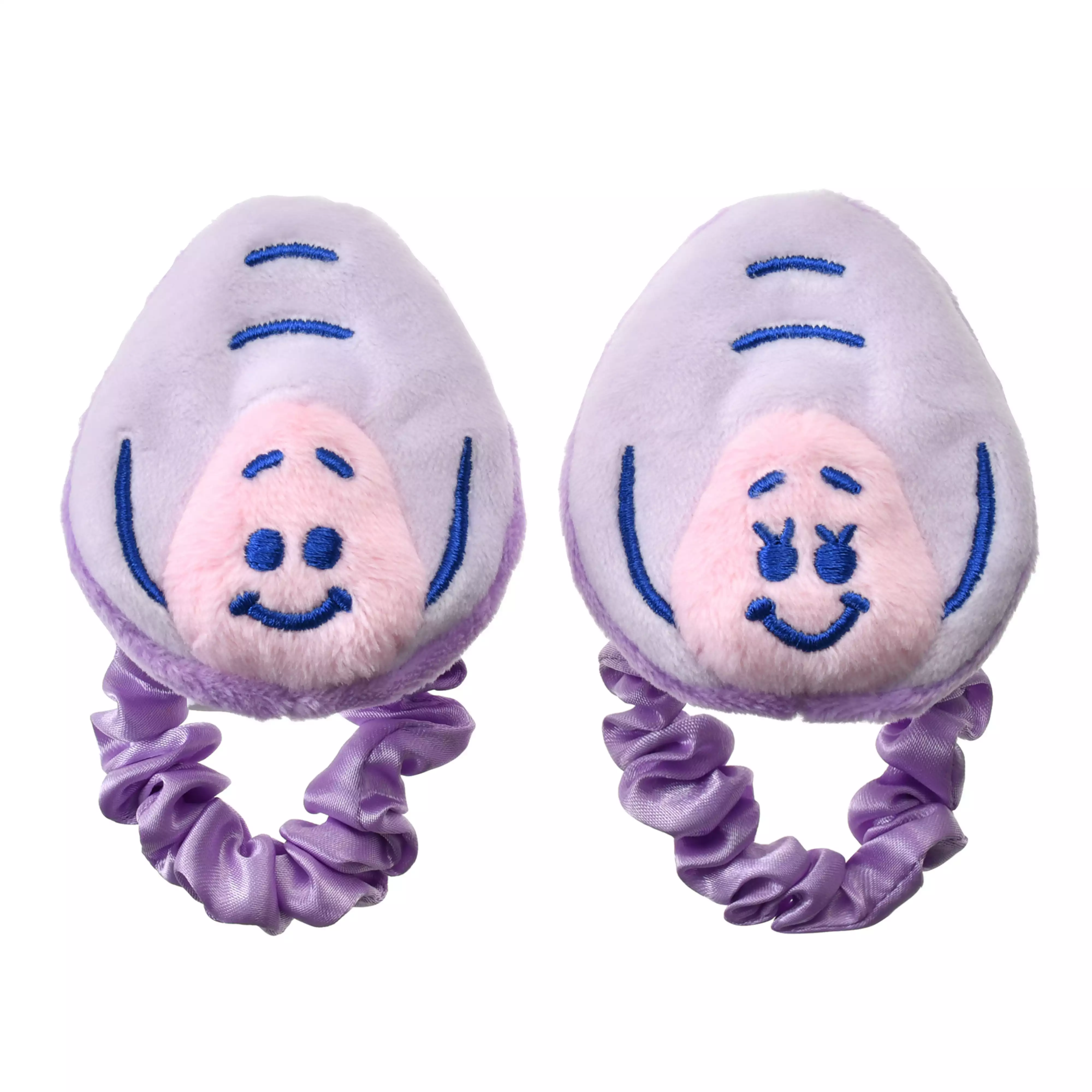 Two purple scrunchie hair bands topped with plush baby oyster character faces.