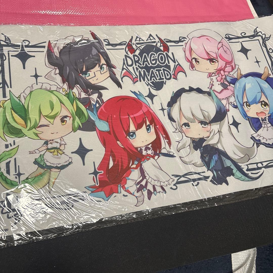 Polyester playmat showing chibi Dragon Maid characters and a 'DRAGON MAID' logo, photographed wrapped in plastic.